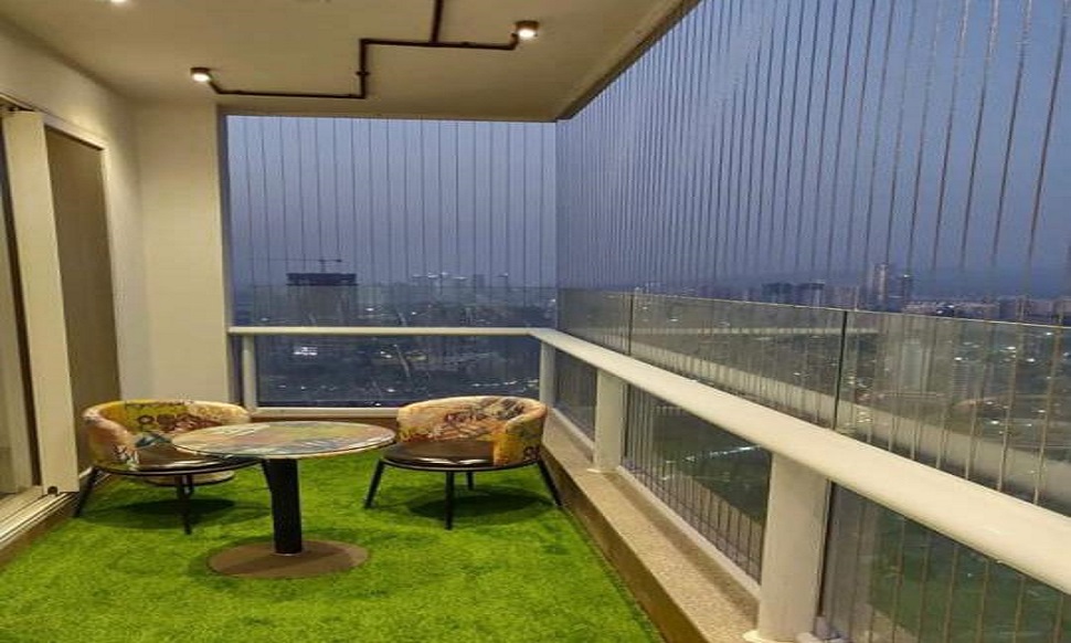 Stainless steel invisible grill fitted to a balcony railing